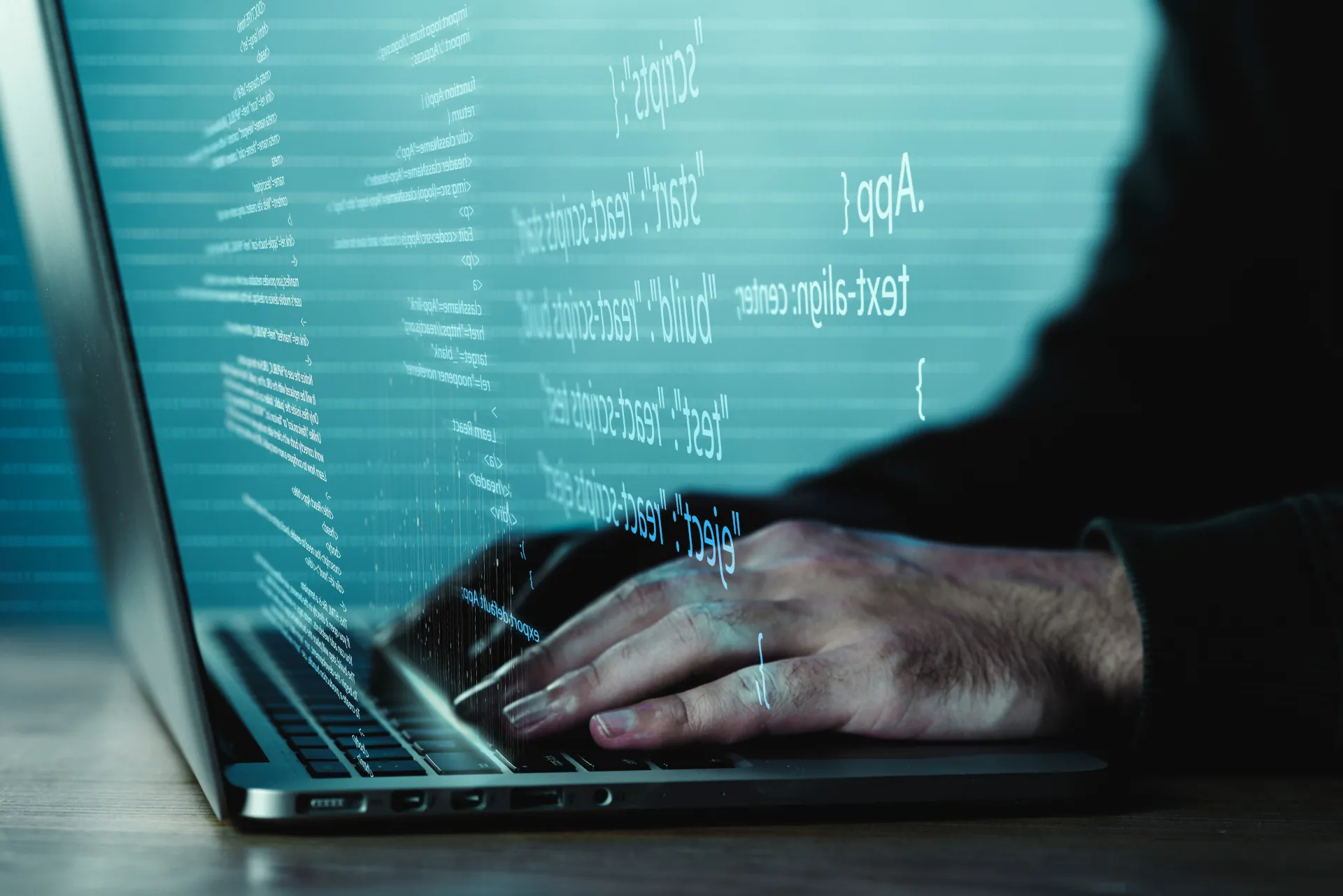 Developer working with code on a laptop, writing test cases in Jira